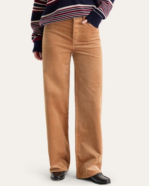 A woman wearing light brown corduroy pants.