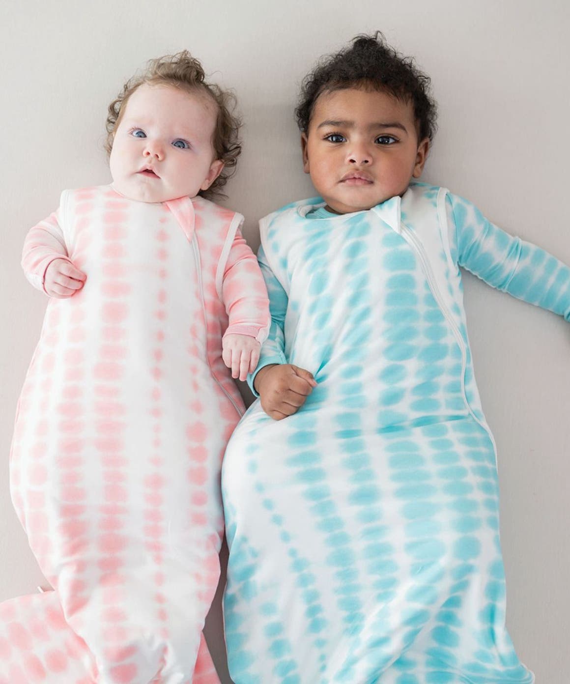 Two babies laying down.