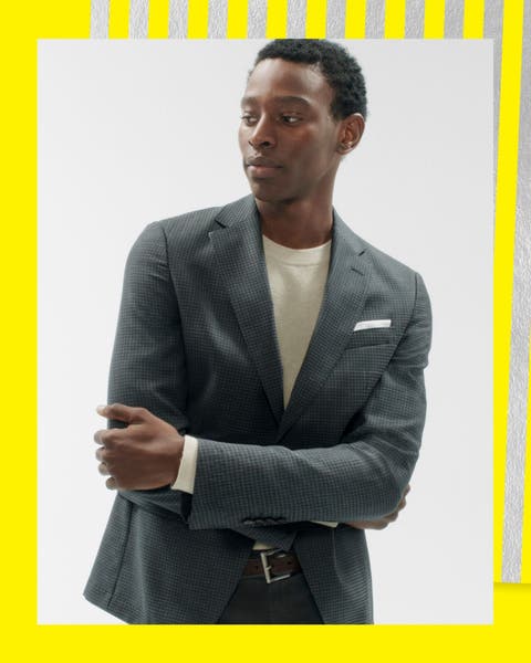 A man wearing a blazer and shirt.