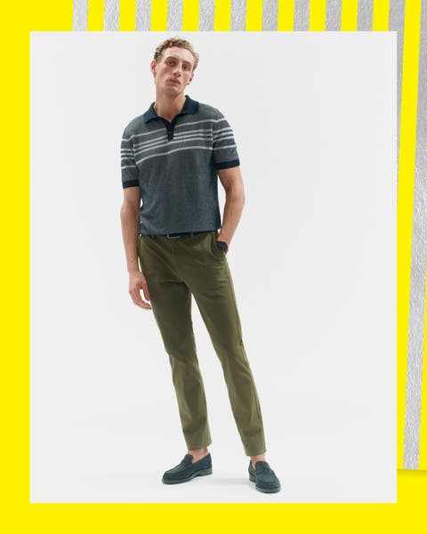 A man wearing a polo and pants.