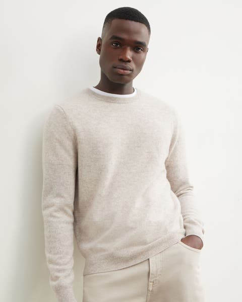 Model wearing cream Nordstrom sweater and pants.