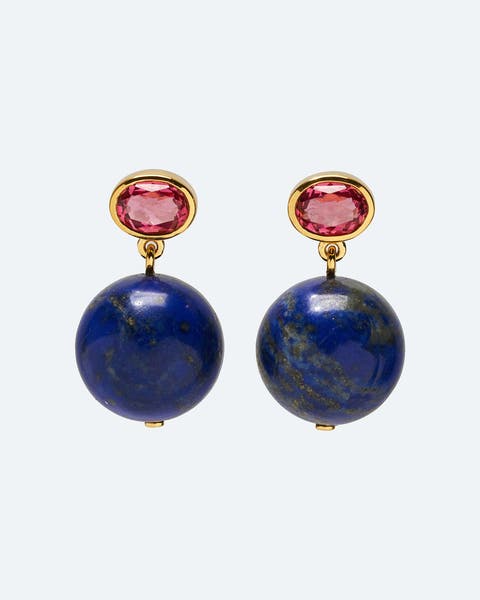 Gold drop earrings with a pink gemstone and a lapis lazuli bead.