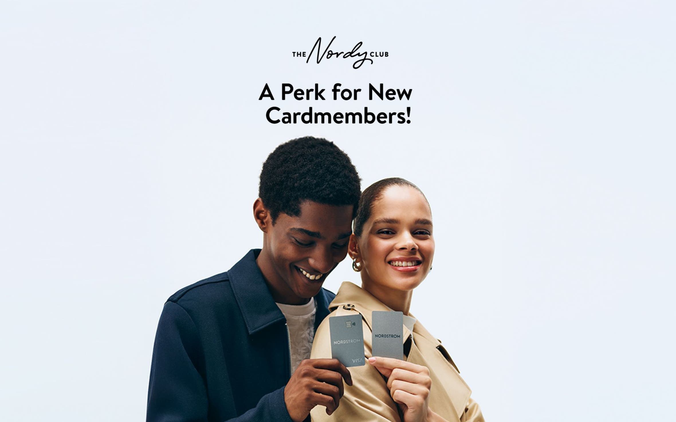 A perk for new cardmembers. A man and a woman holding up their Nordstrom cards.