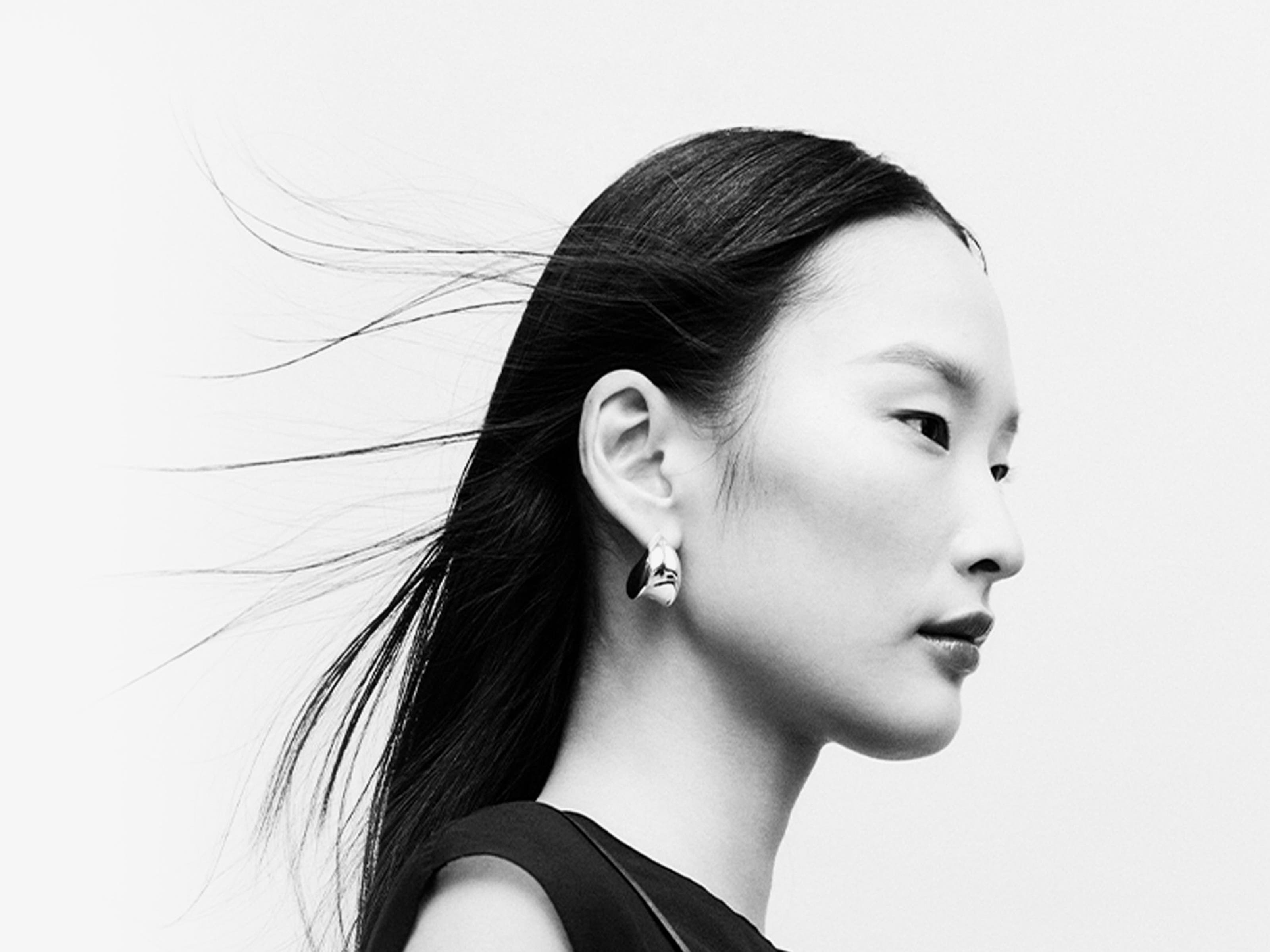 Woman wearing designer pieces.
