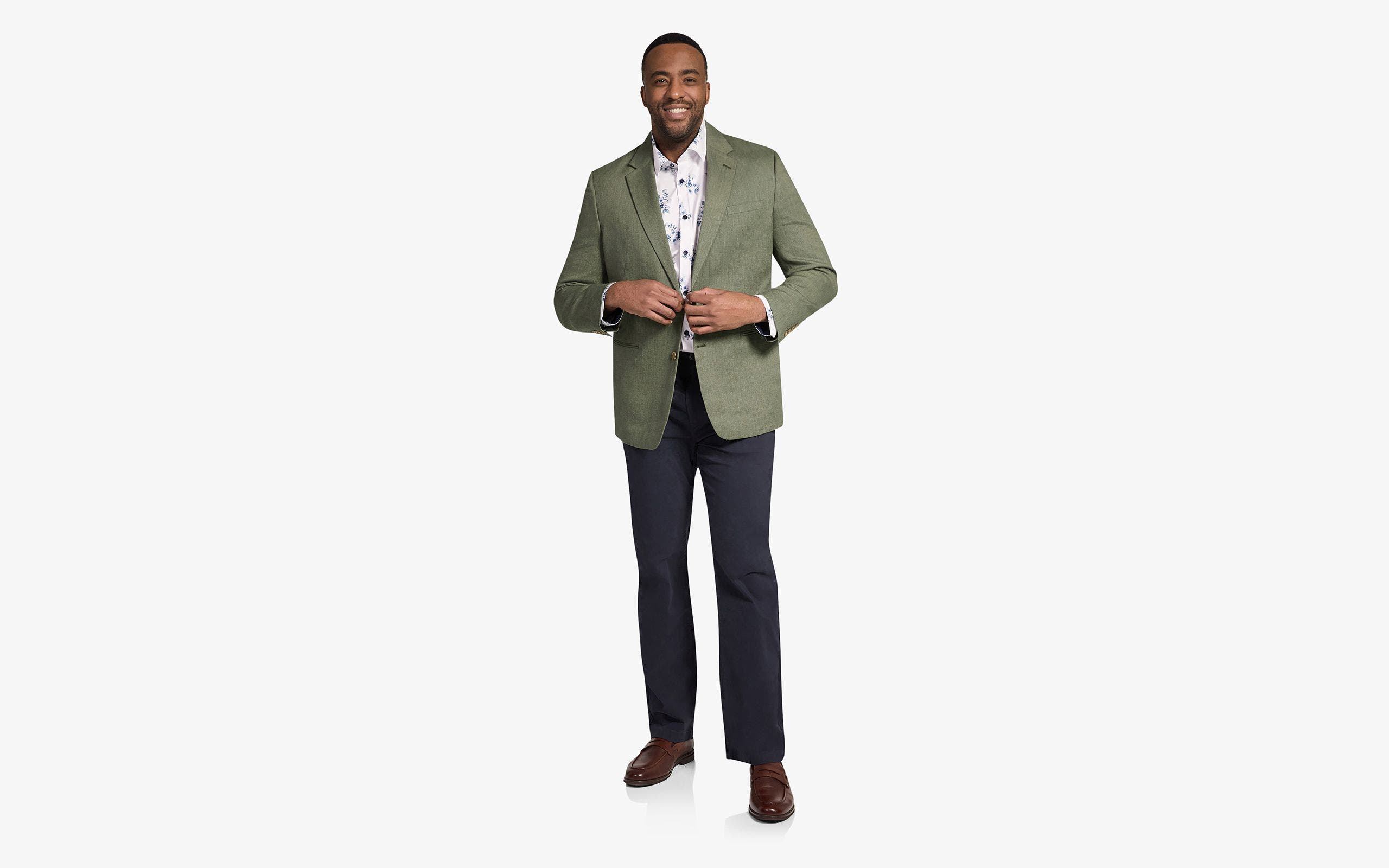 A man wearing a green sport coat in a big and tall size. 
