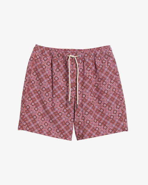 A man wearing swim trunks.