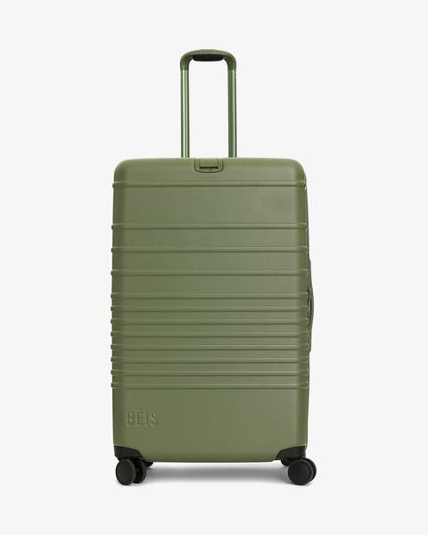 A green roller suitcase.