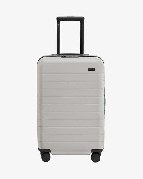 A grey roller suitcase.