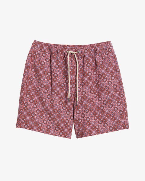 Patterned pink swim shorts.