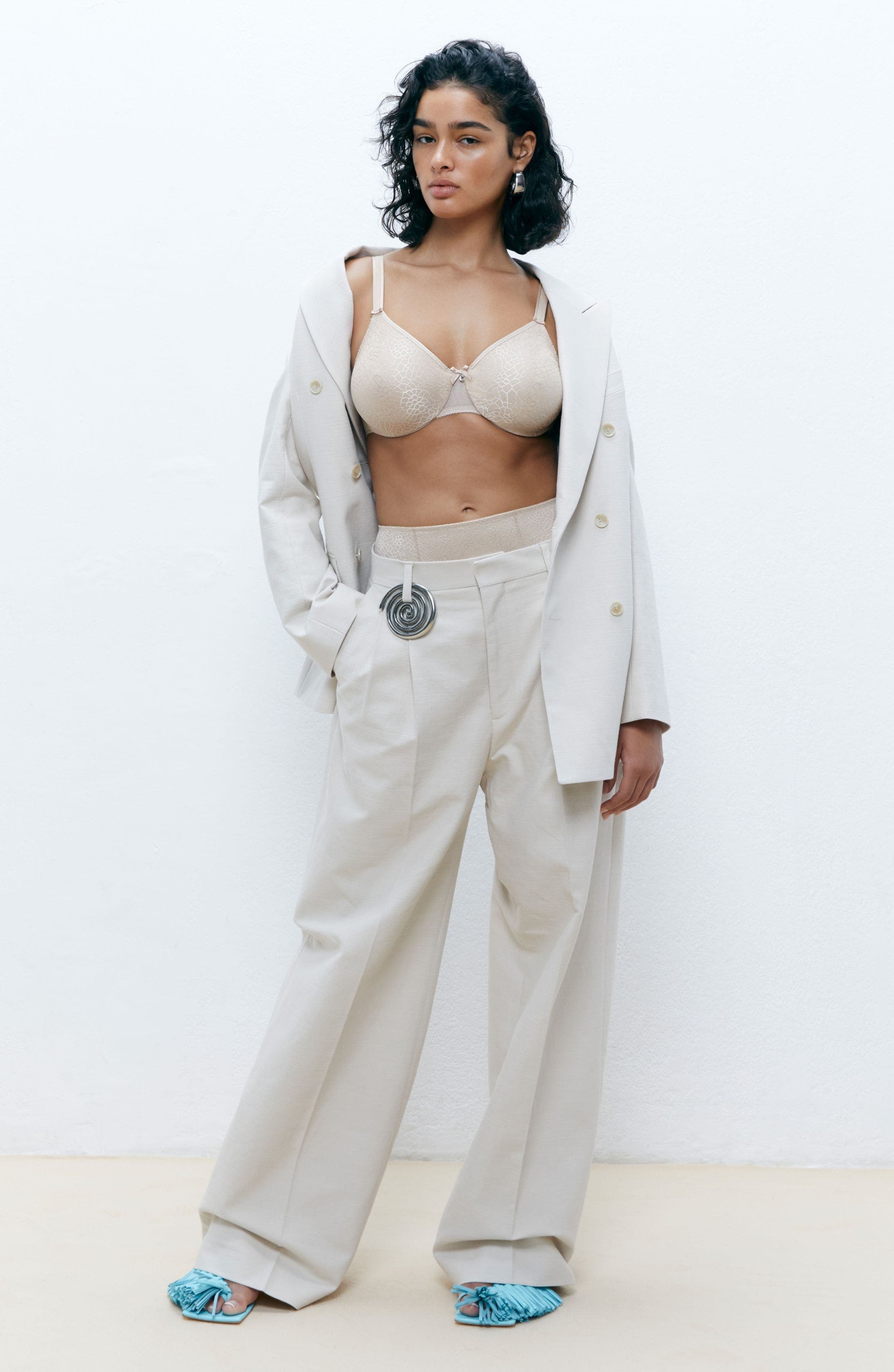 Woman wearing a bra that can be altered to add pockets. 