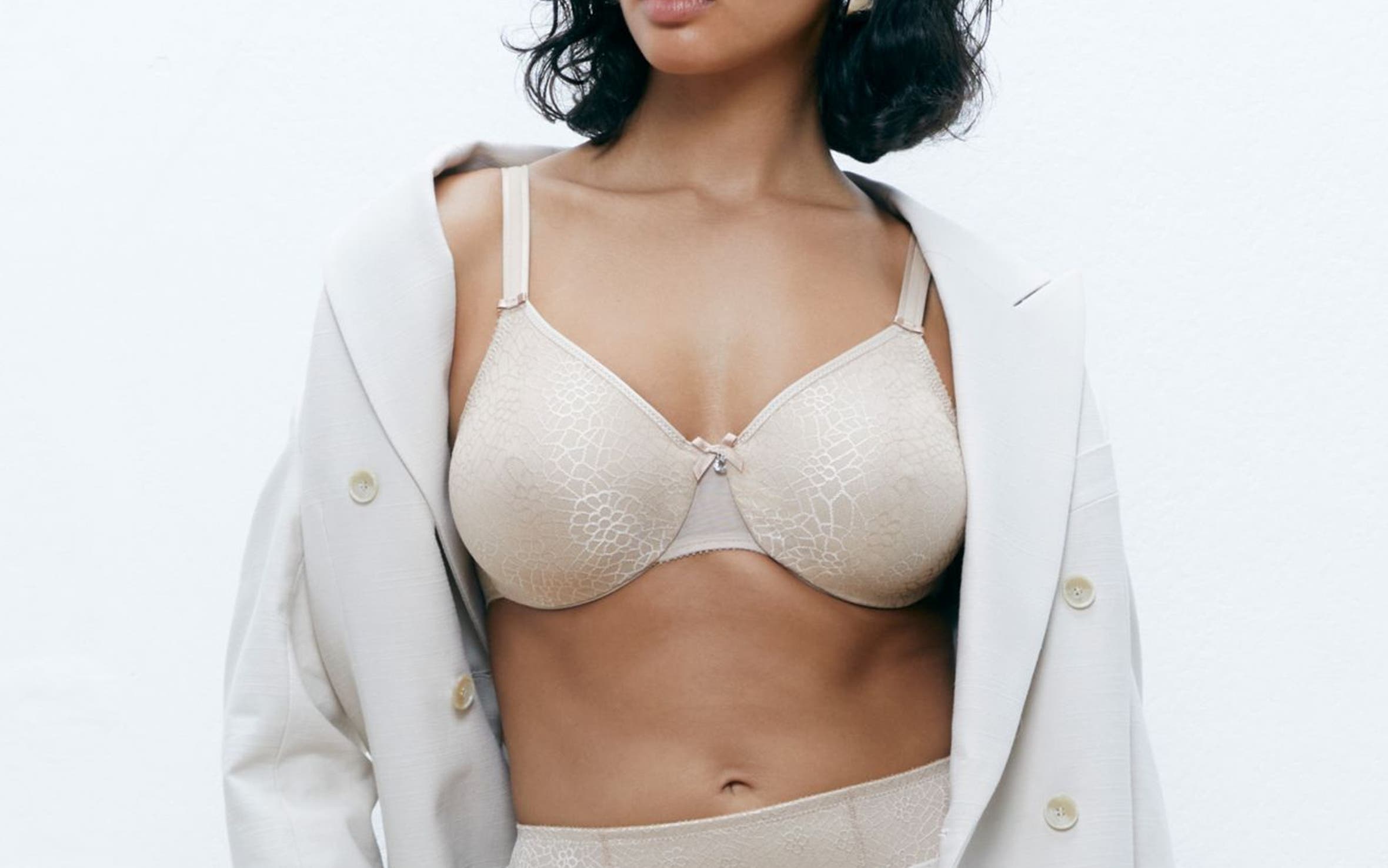 Woman wearing a bra that can be altered to add pockets.