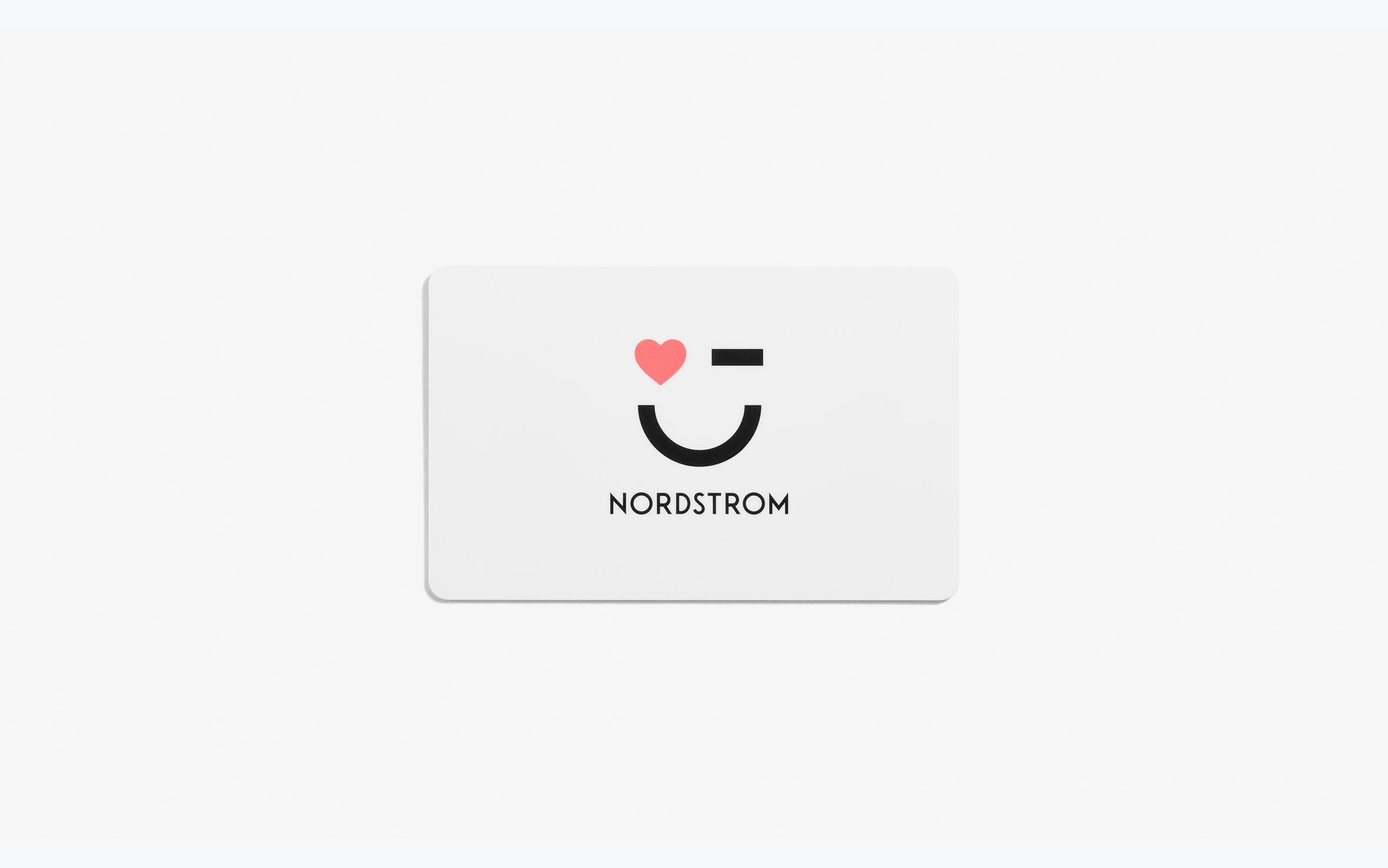 A Nordstrom gift card with a smile and wink.