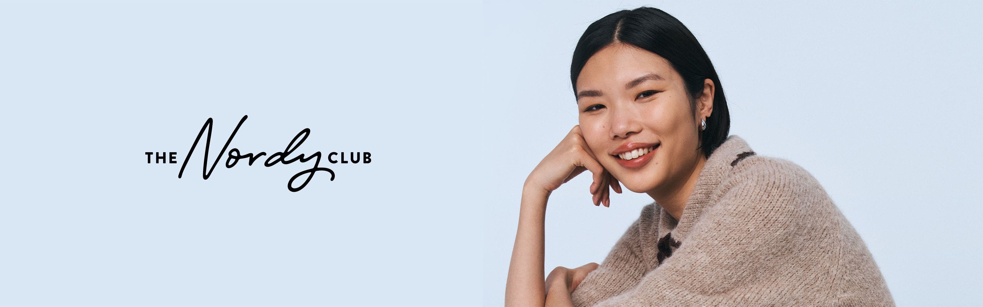 The Nordy Club; a smiling woman.