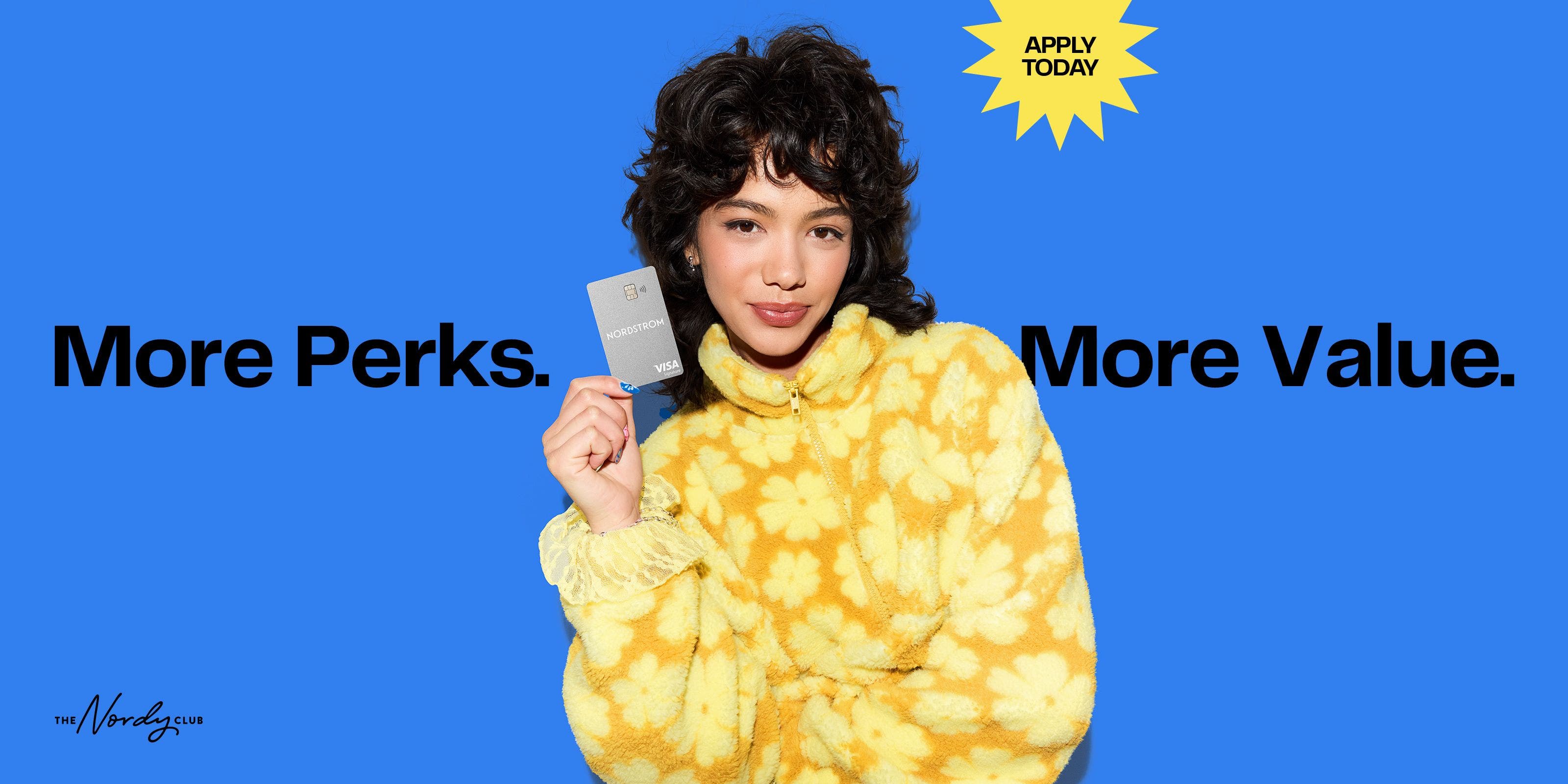 More perks, more value. A woman holding a Nordstrom credit card.