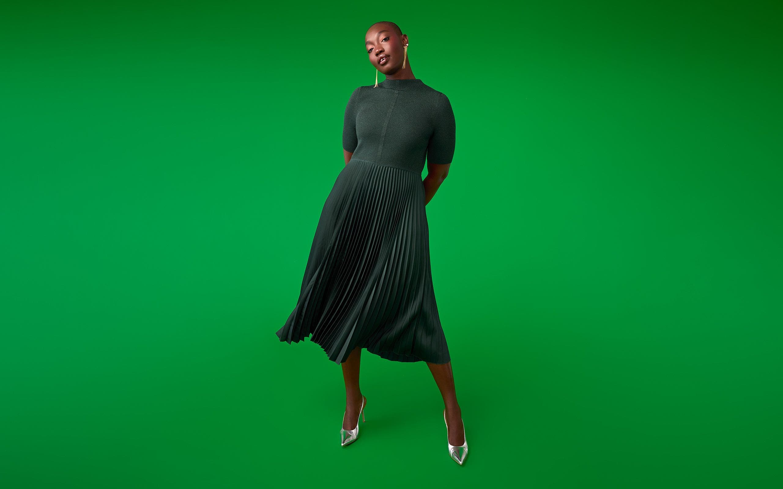 A woman wearing a sweater dress.