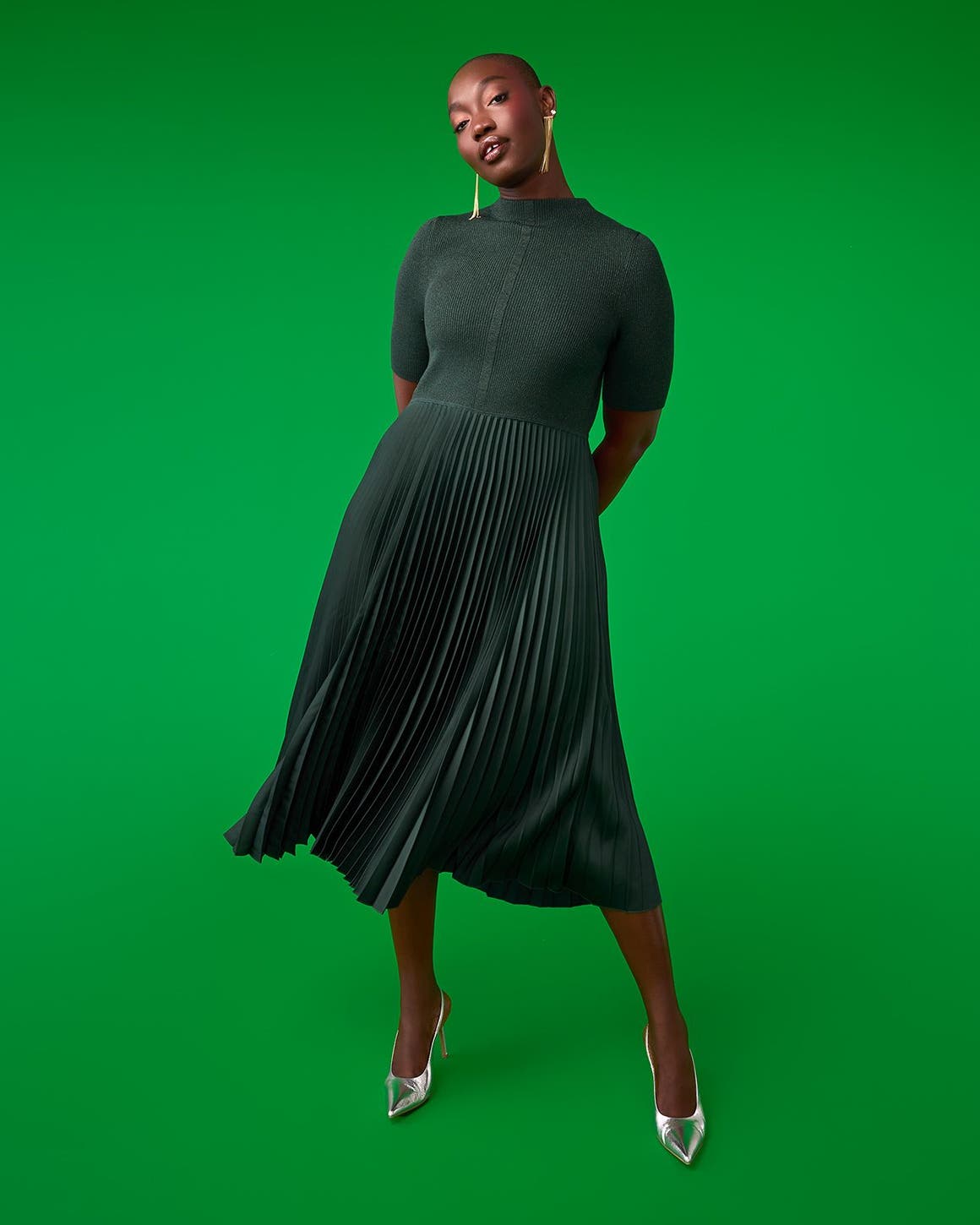 A woman wearing a sweater dress.