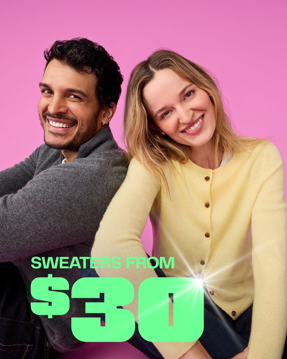 A woman and a man wearing sweaters.