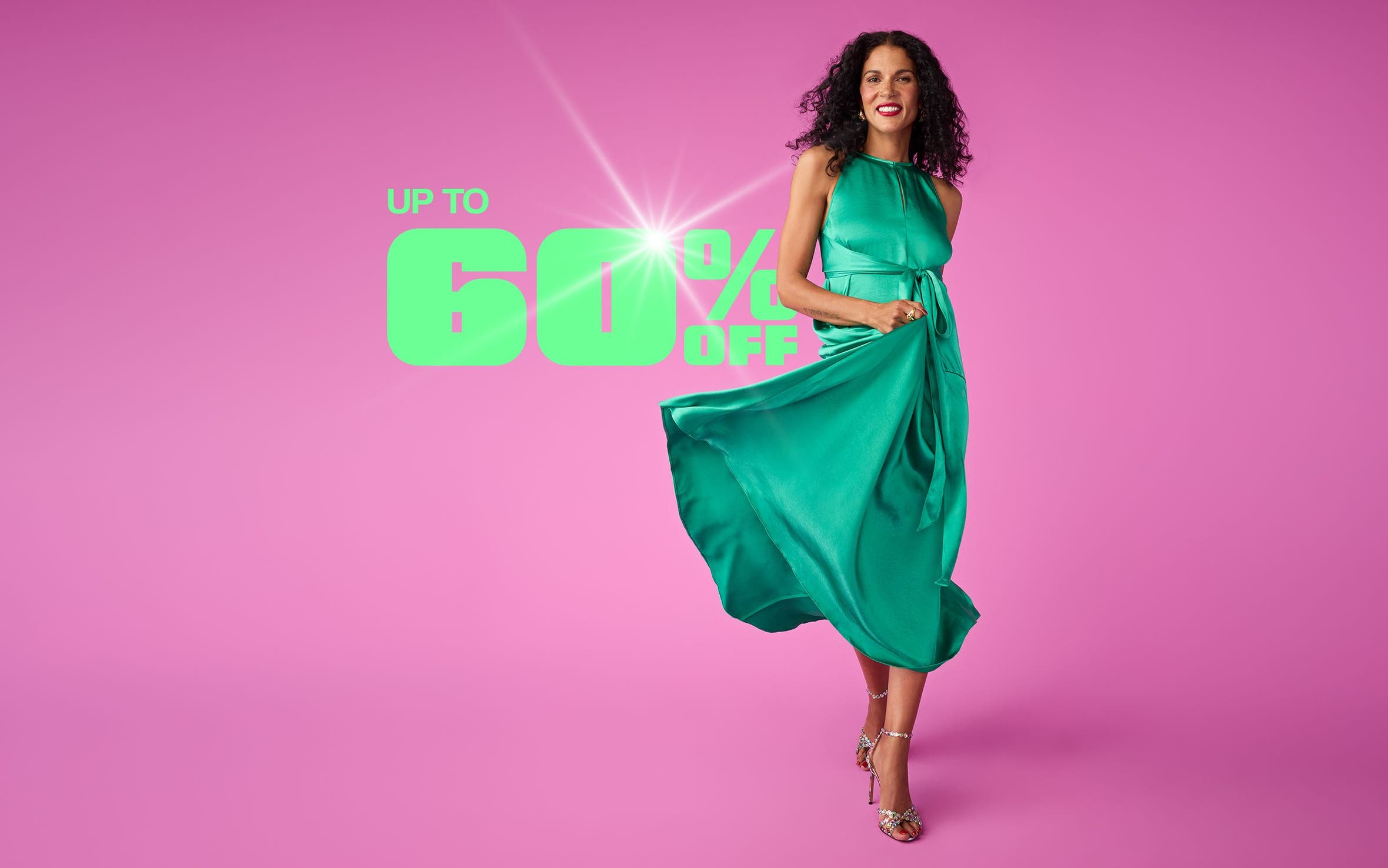 A woman wearing a sleeveless green dress.