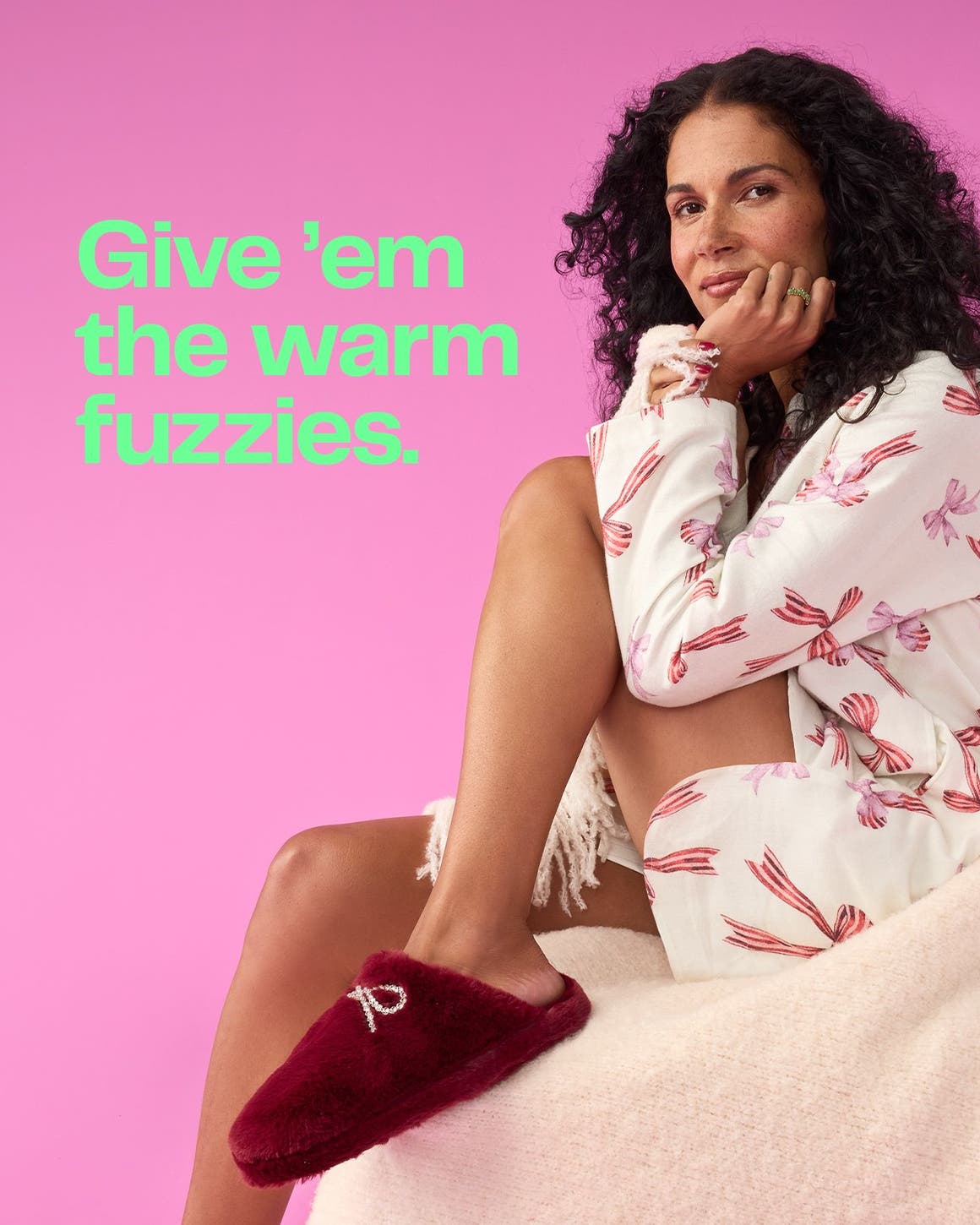 A woman wearing loungewear and slippers.