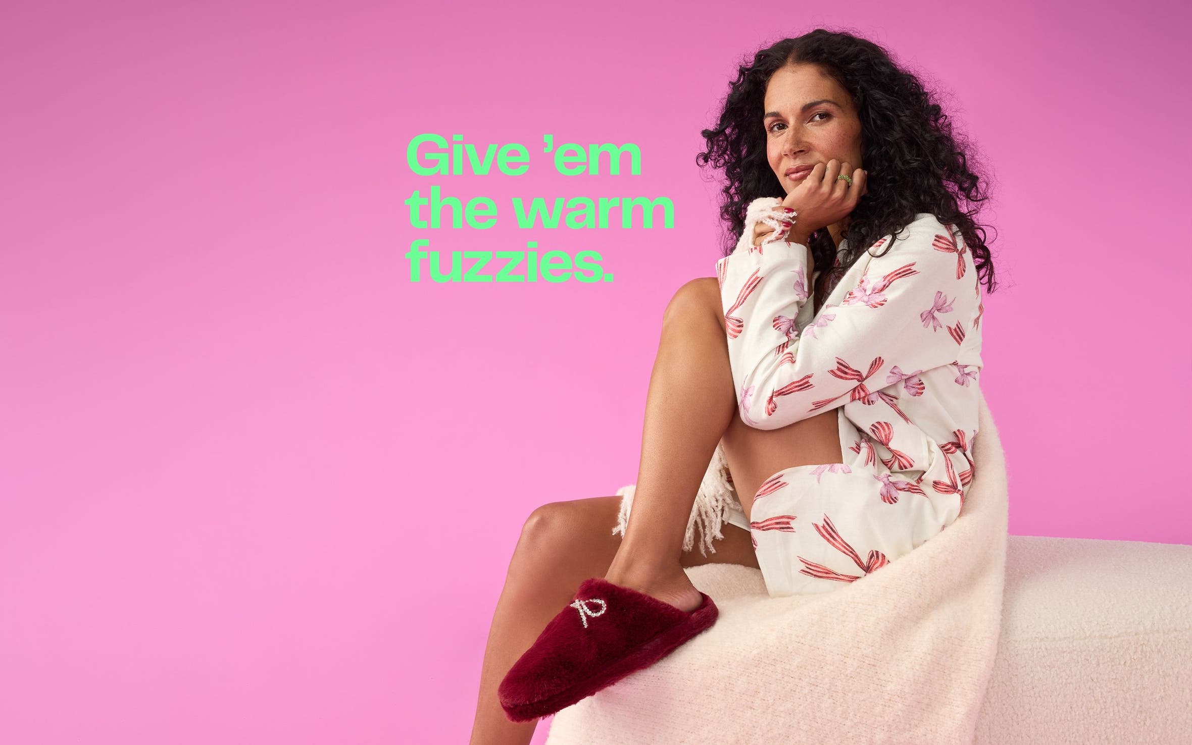 A woman wearing loungewear and slippers.