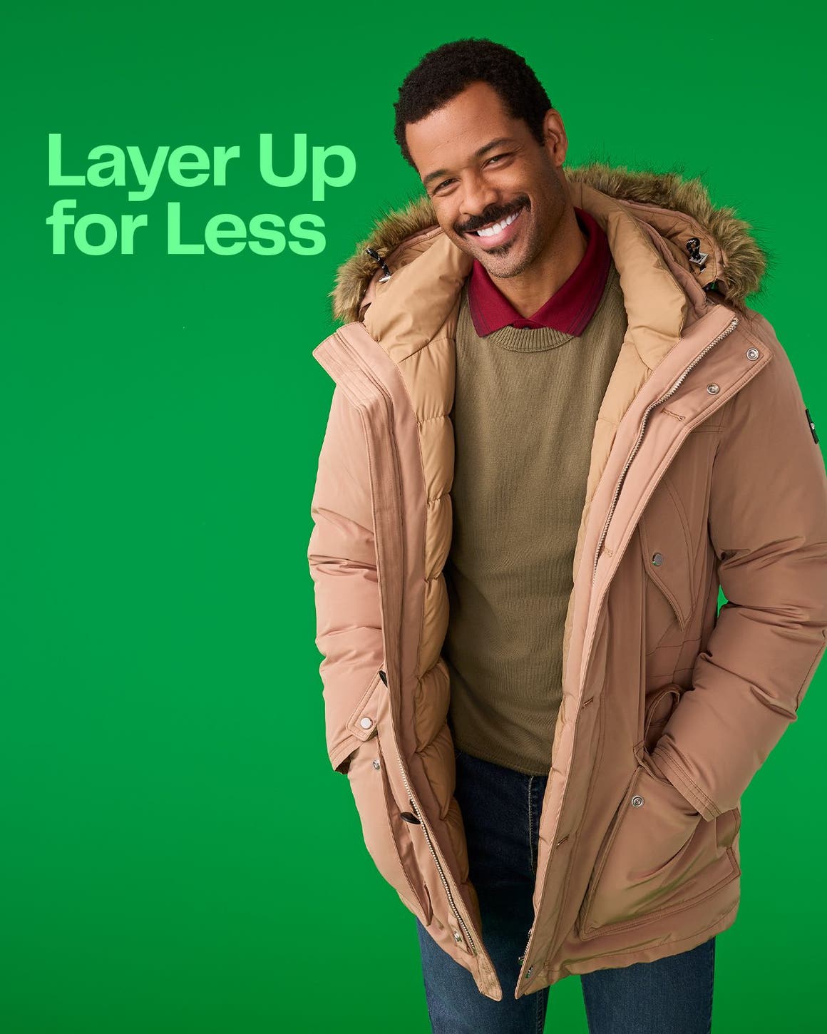 A man wearing a polo shirt, sweater and coat.