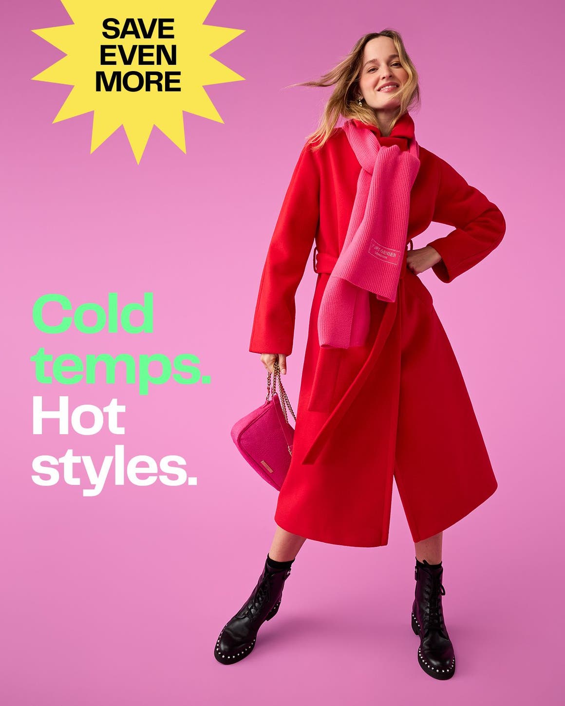 A woman wearing a red coat, pink scarf and black studded boots.