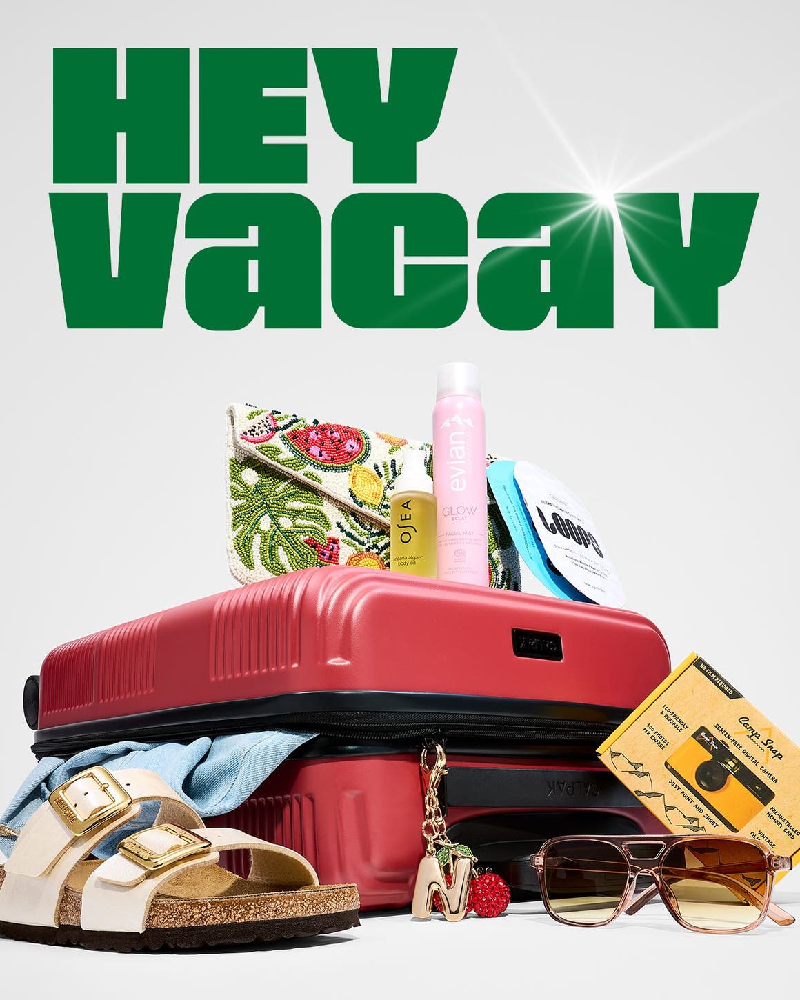 A suitcase with warm-weather travel items.