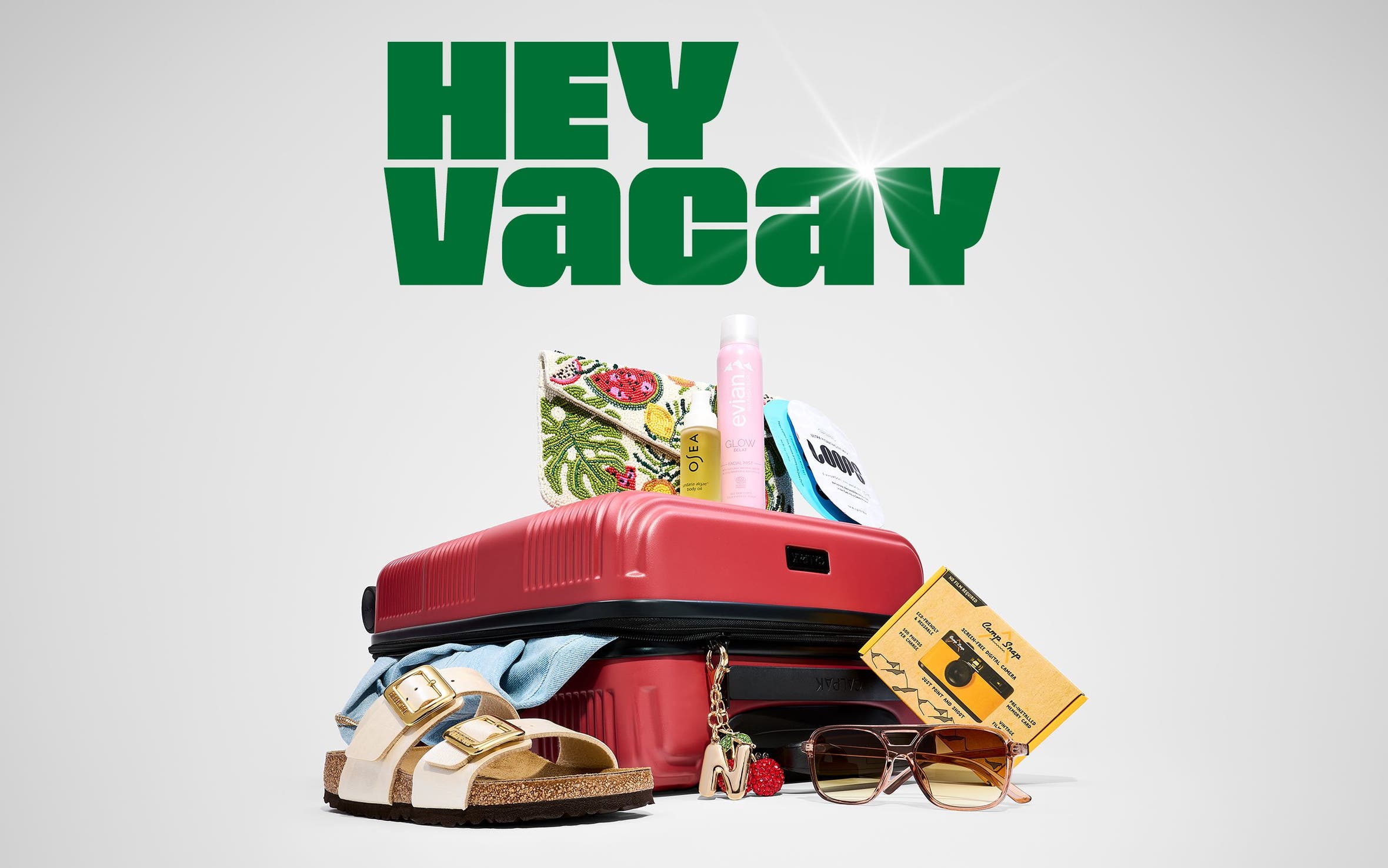 A suitcase with warm-weather travel items.