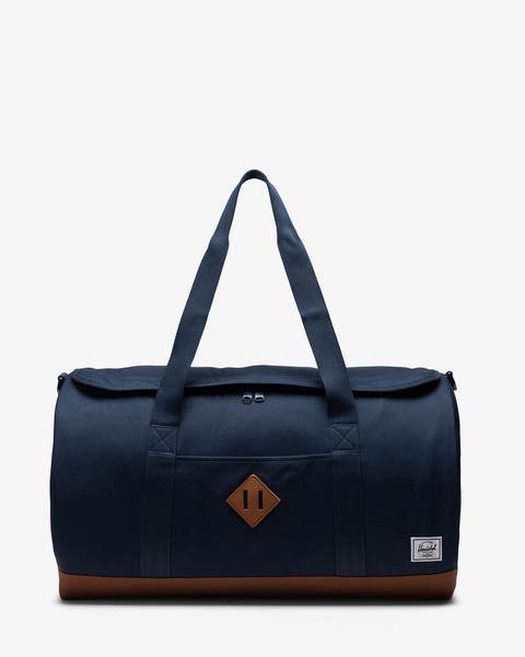 A navy blue duffle bag.