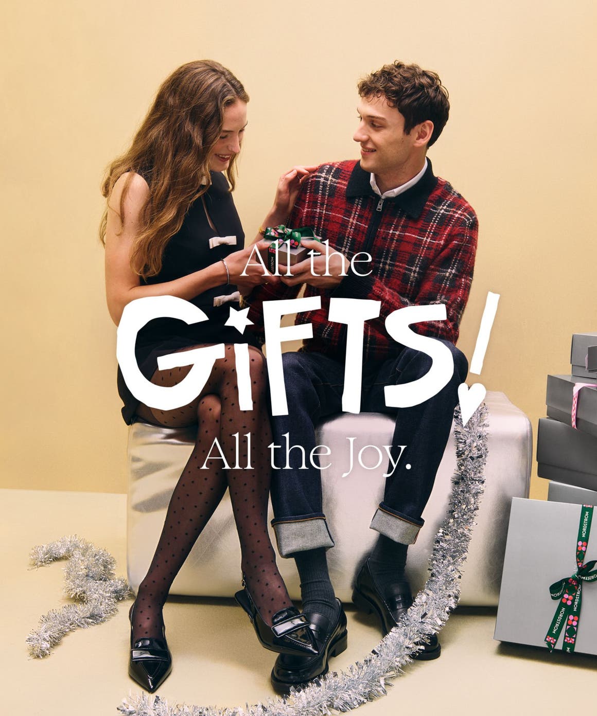 All the gifts, all the joy: a woman and man exchanging holiday gifts.