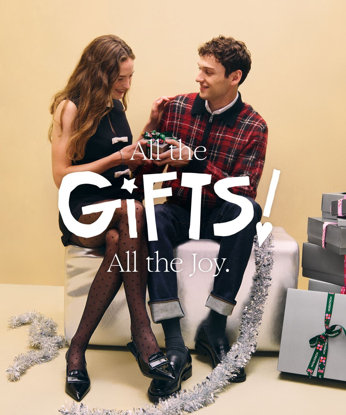 A little girl holding a gift box.