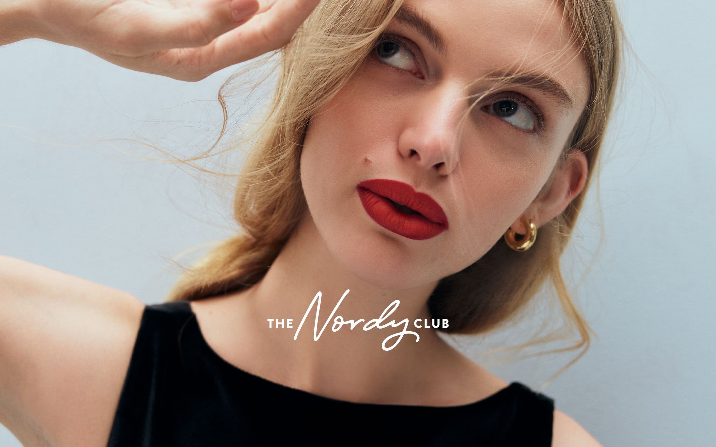 A woman wearing red lipstick.