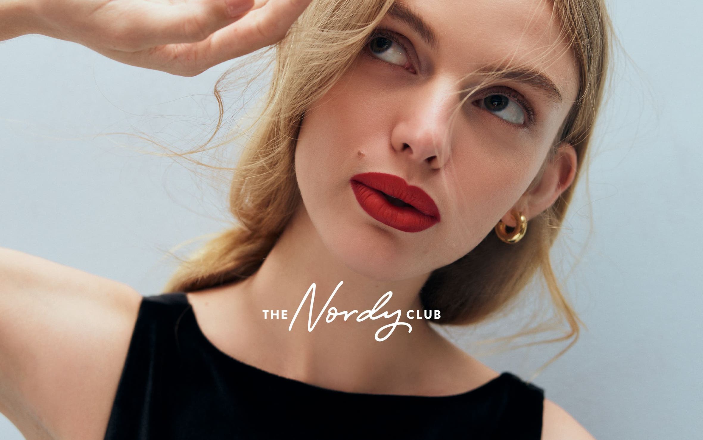 A woman wearing red lipstick.