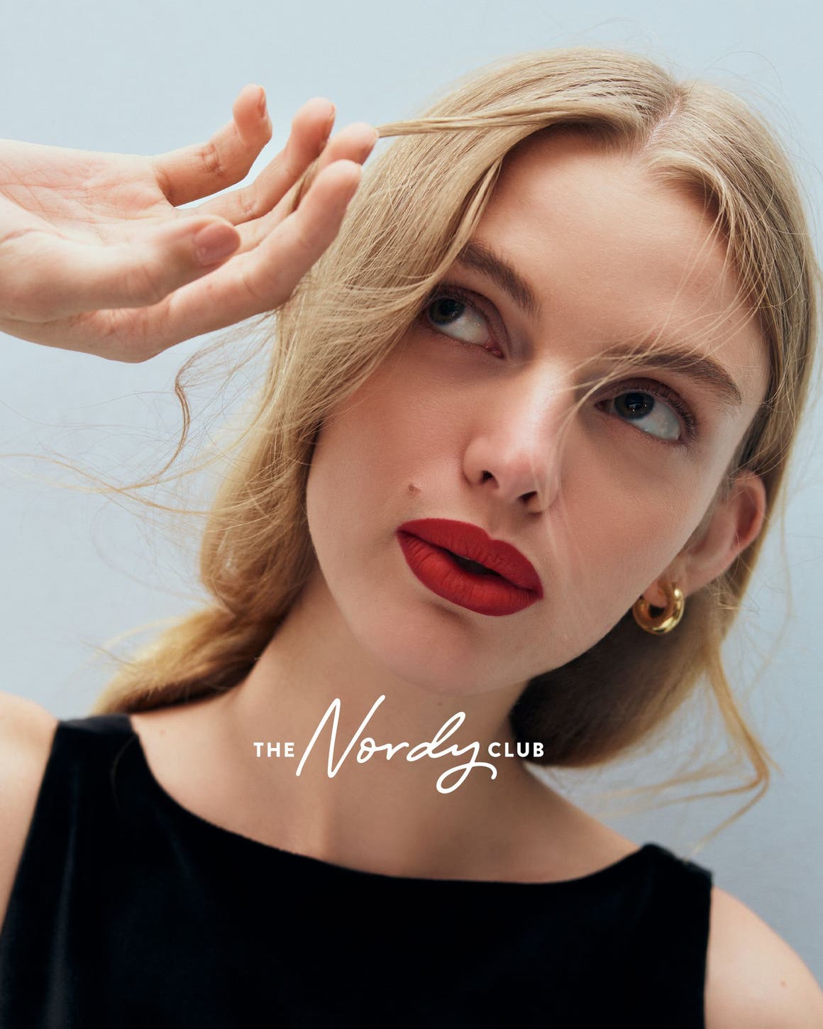 A woman wearing red lipstick.