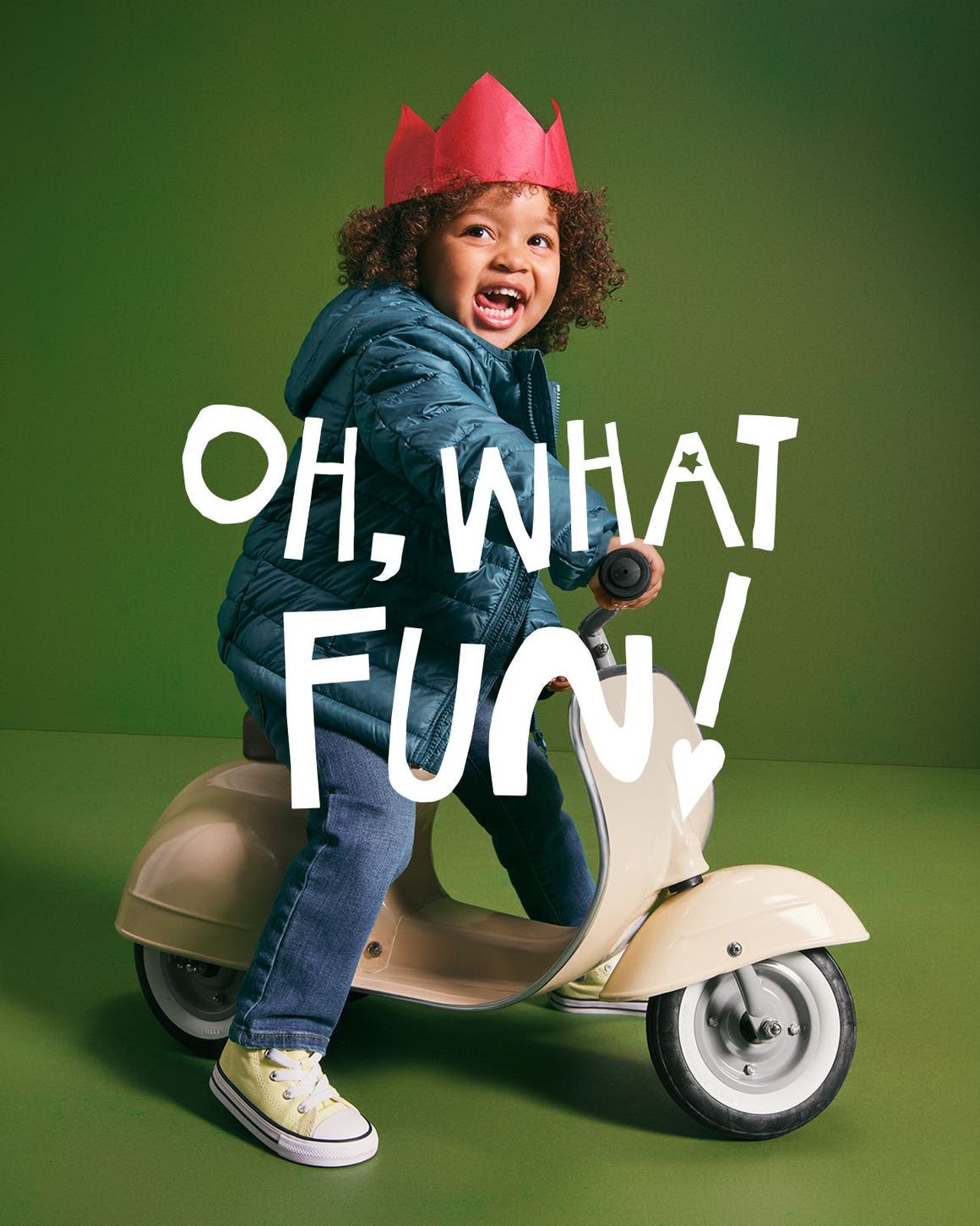 Oh, what fun! A kid riding a toy scooter.