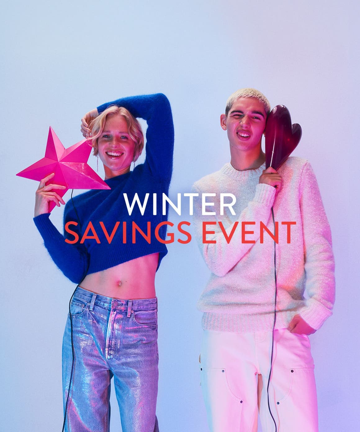 Winter savings event. A woman and man wearing sweaters and jeans.
