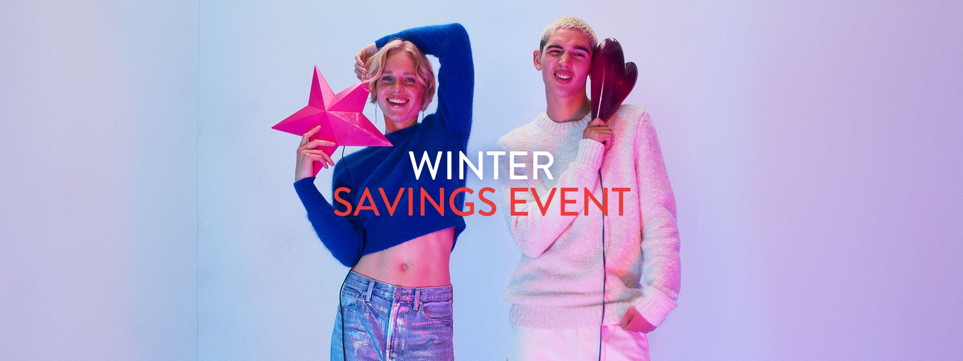 Winter savings event. A woman and man wearing sweaters and jeans.