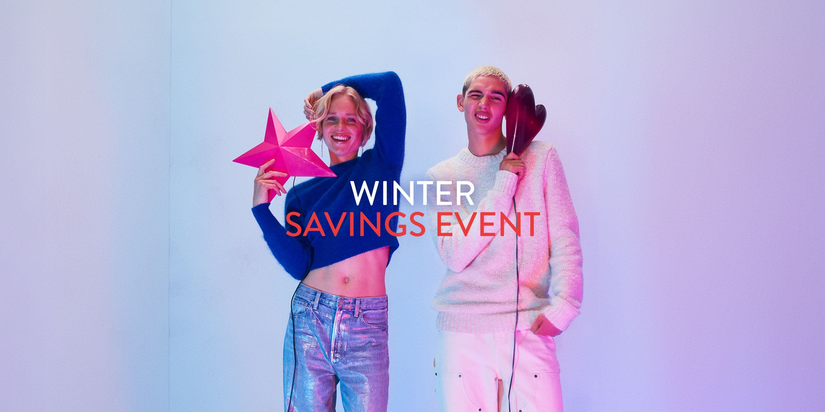 Winter savings event. A woman and man wearing sweaters and jeans.