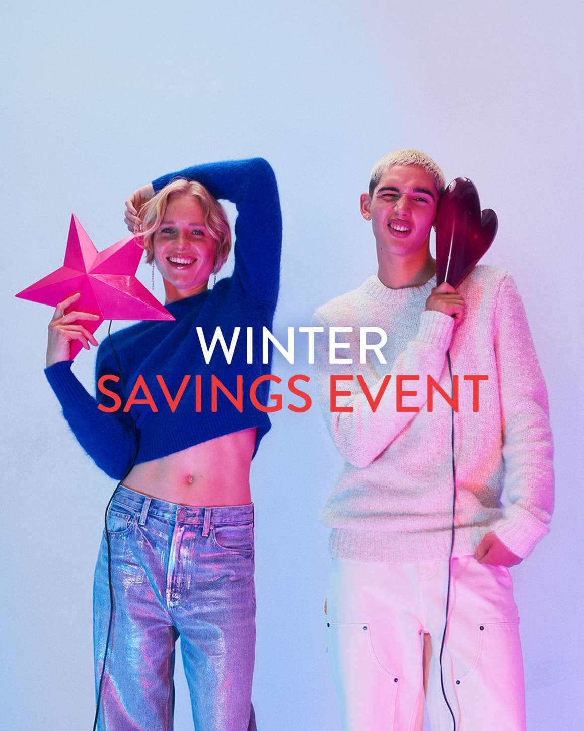 Winter savings event. A woman and man wearing sweaters and jeans.