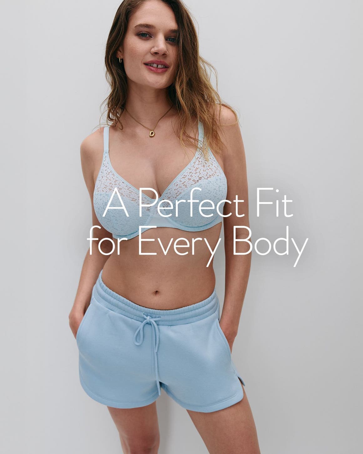 A perfect fit for every body. A woman wearing a bra and lounge shorts.