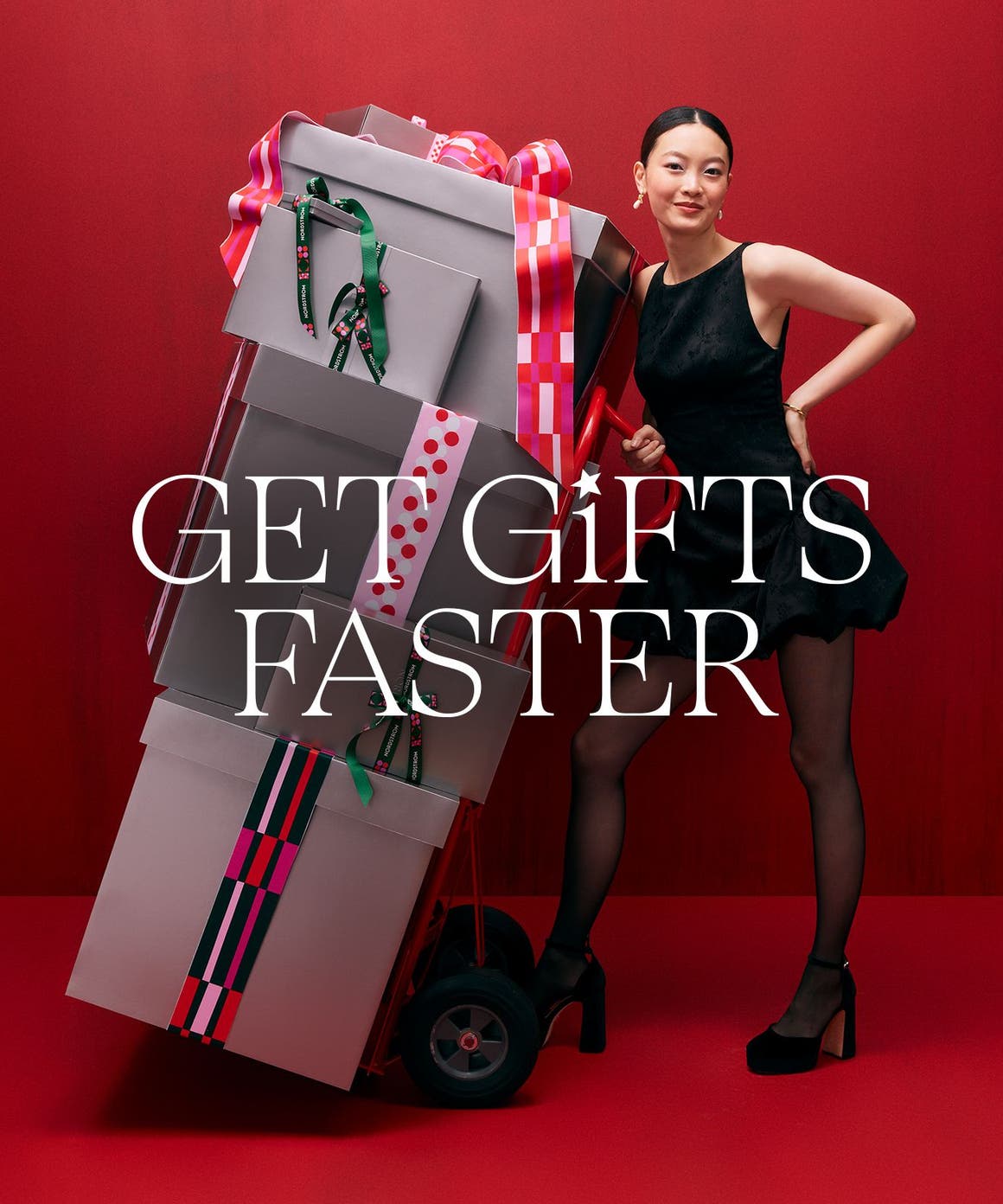 Get gifts faster. A woman with a stack of gift boxes. 