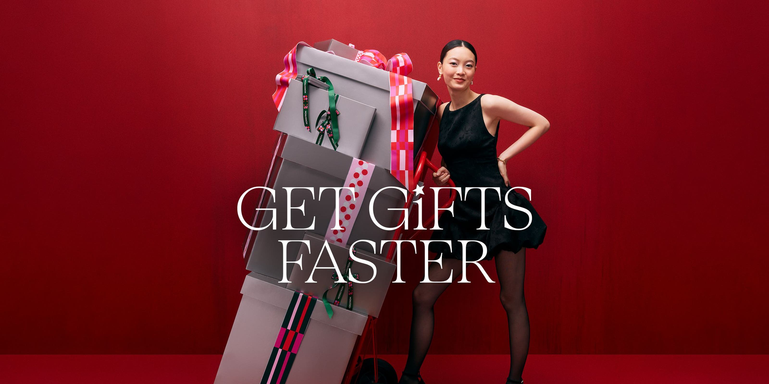 Get gifts faster. A woman with a stack of gift boxes. 