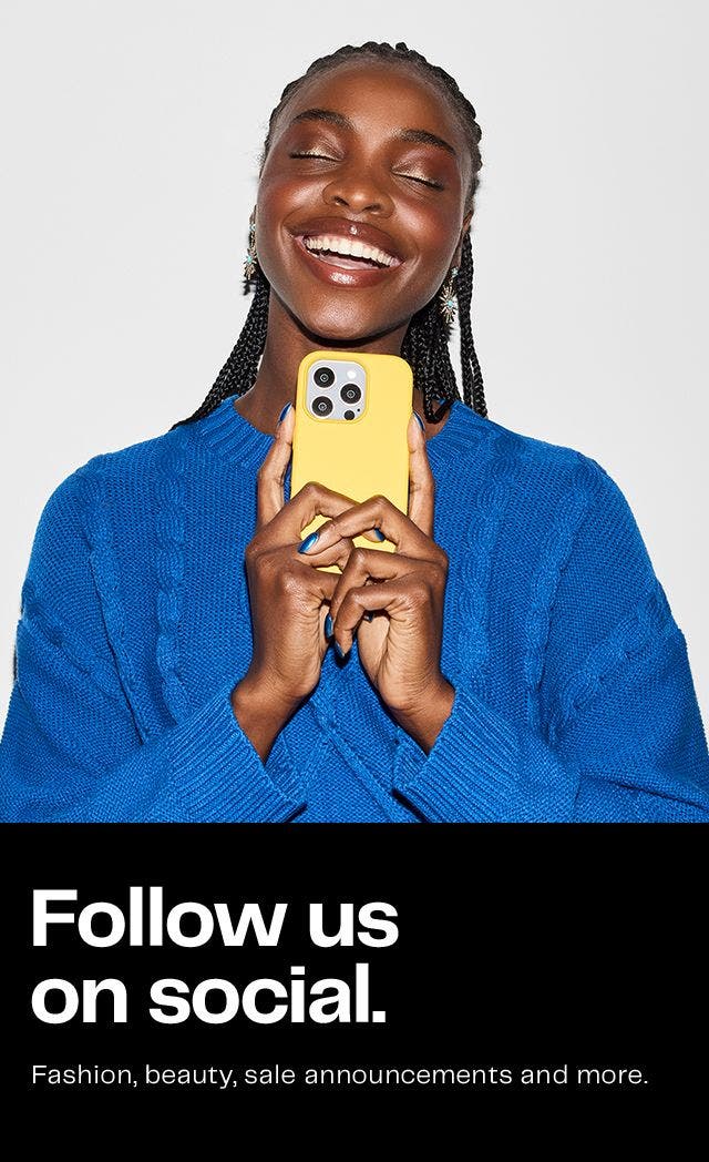 Follow us on social. A woman holding a yellow phone.