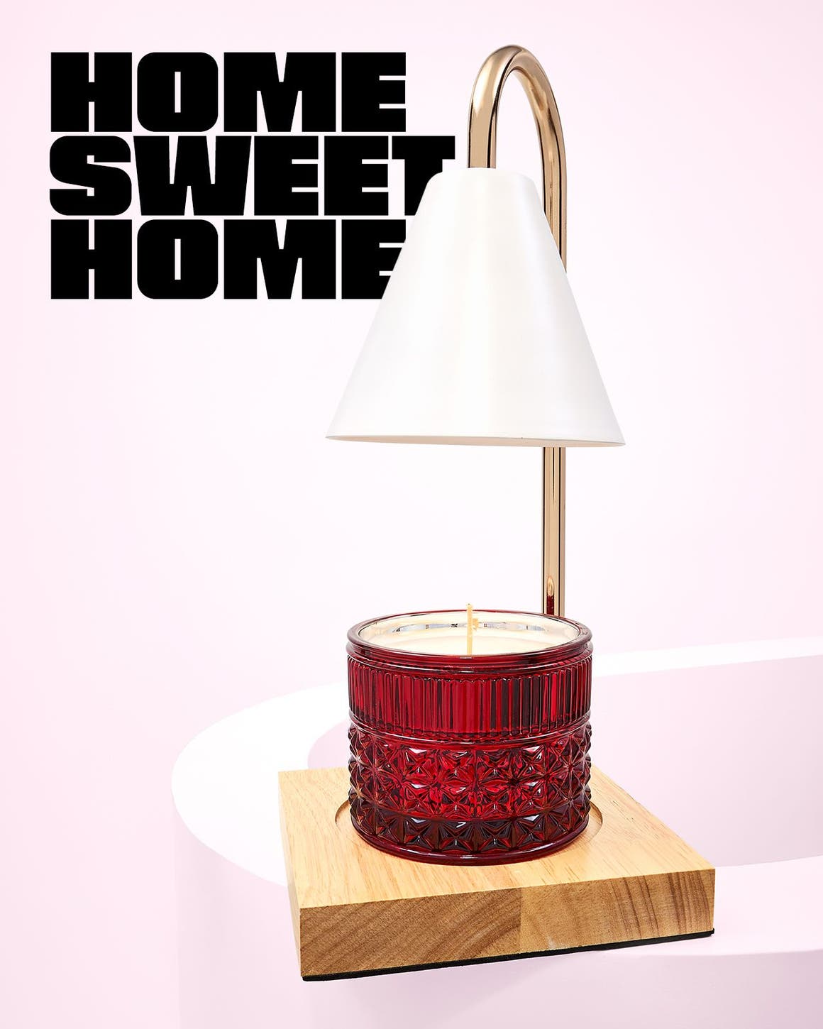 Gold candle warmer with a red candle.