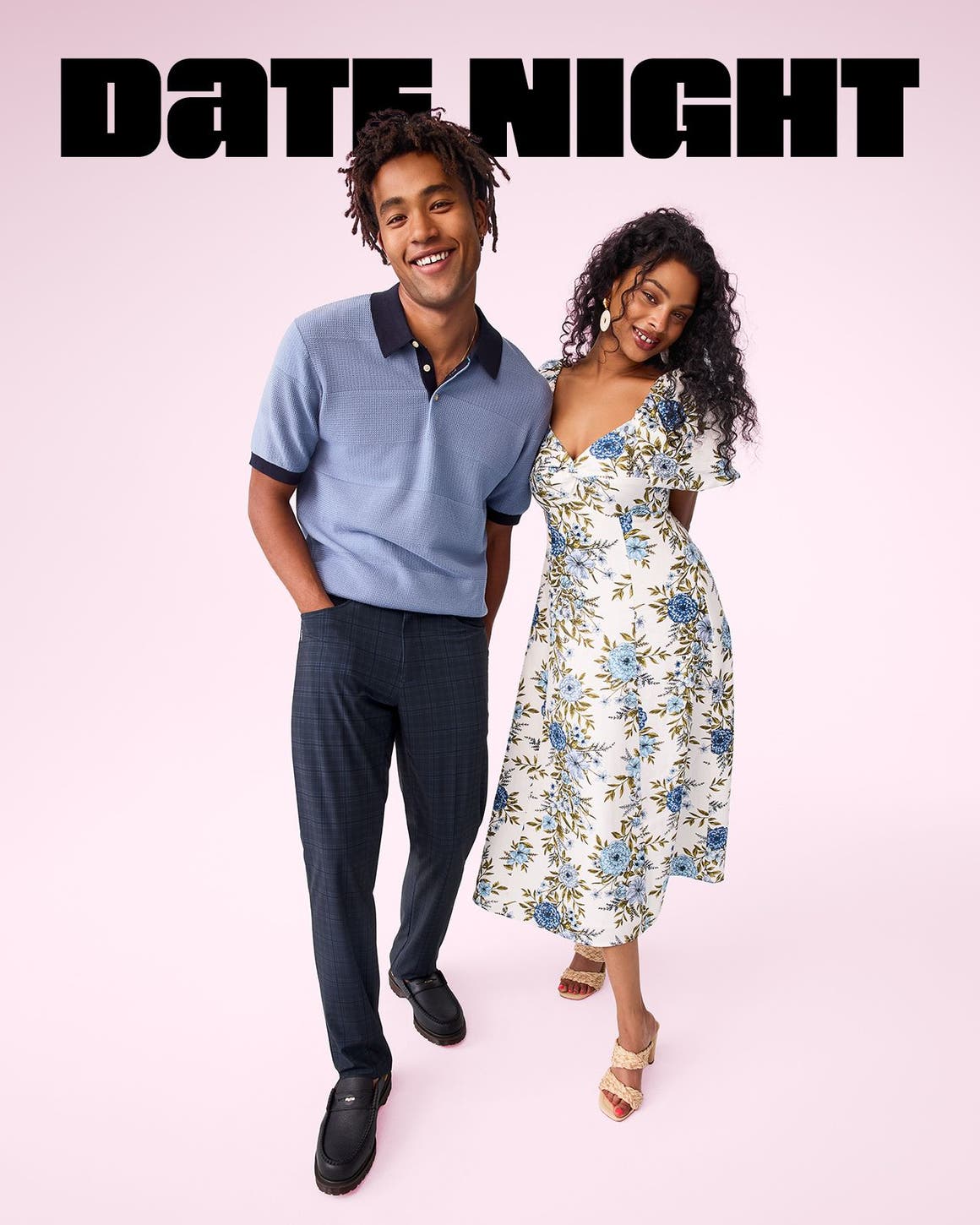 A man and a woman standing in date night outfits.