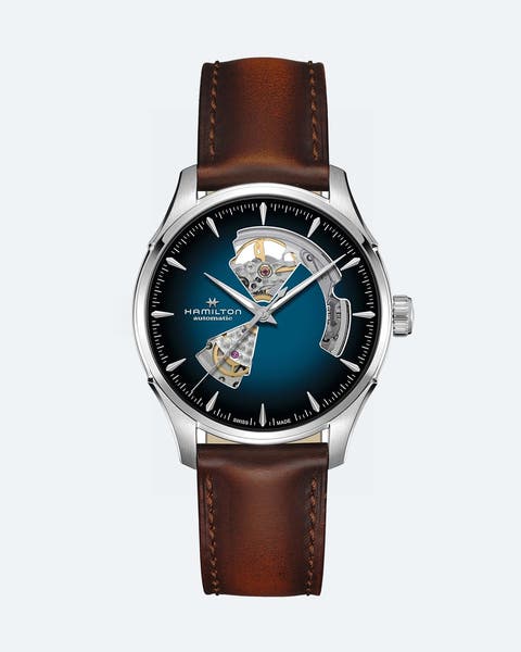 A watch with a brown band and blue face.