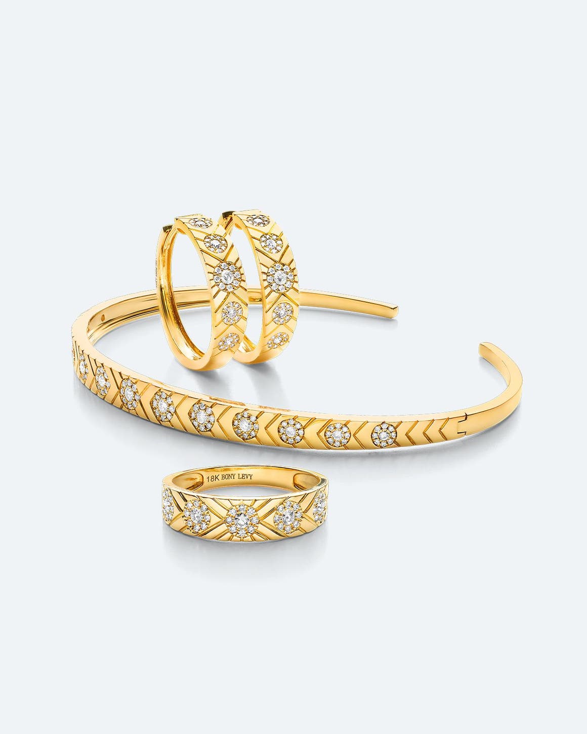 Gold and diamond earrings, bracelet and ring.