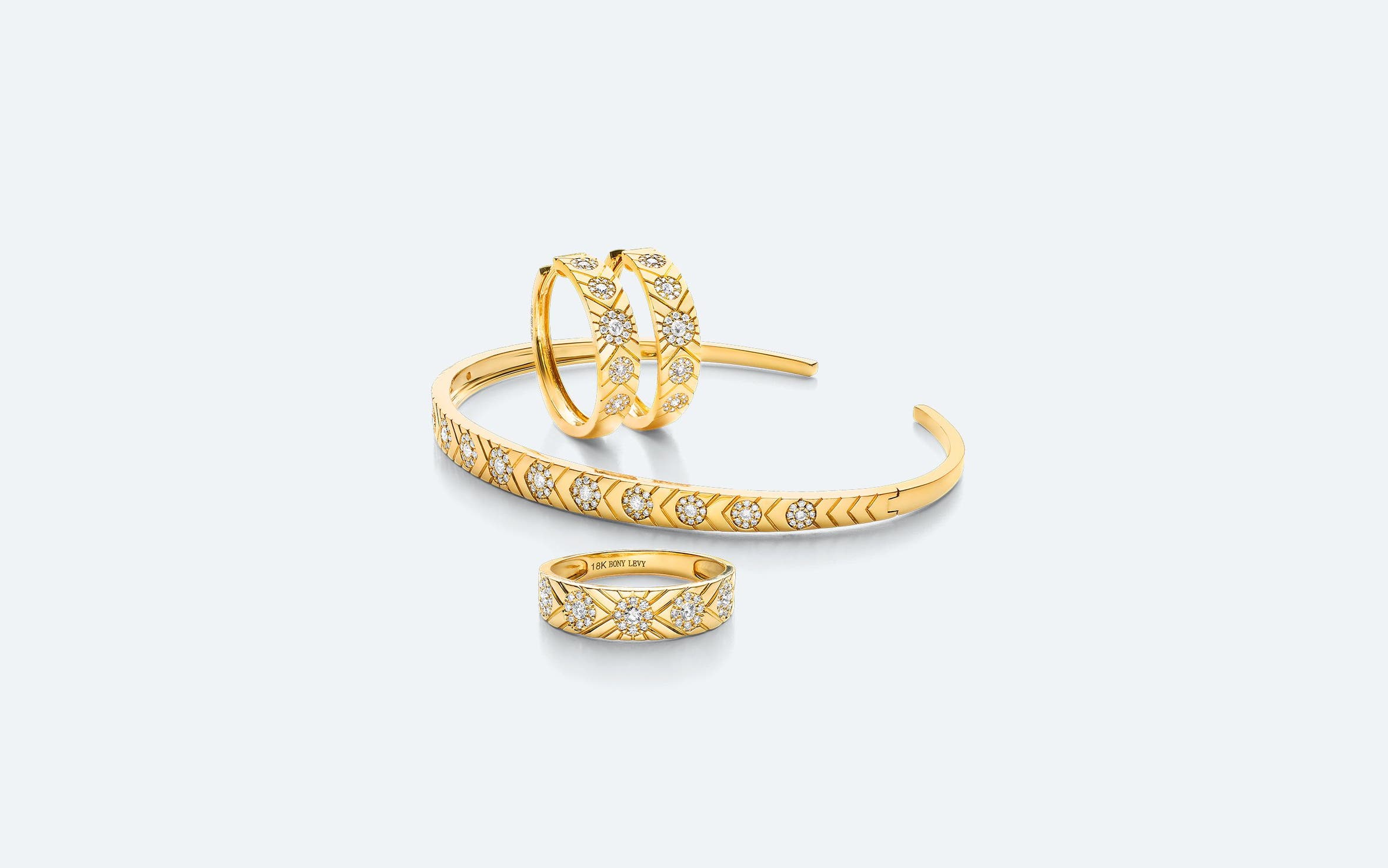 Gold and diamond earrings, bracelet and ring.