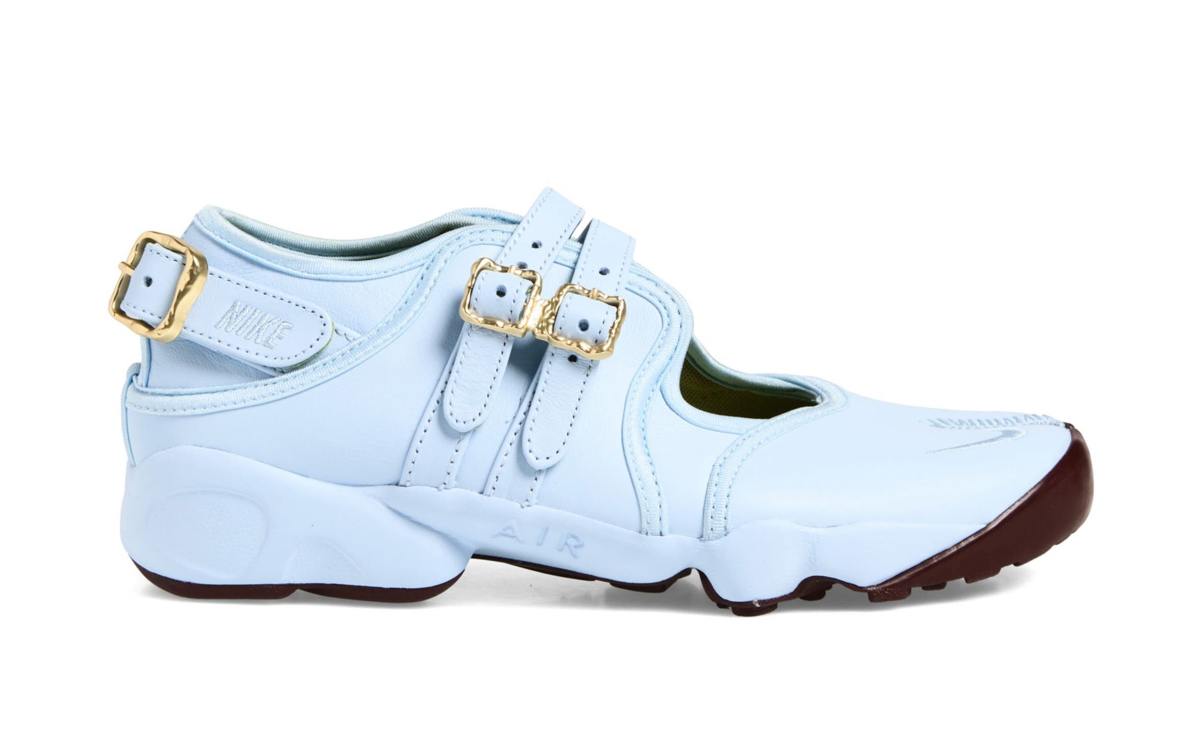 Blue Nike sneaker with buckles.