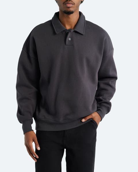 Man wearing a polo-neck sweatshirt.
